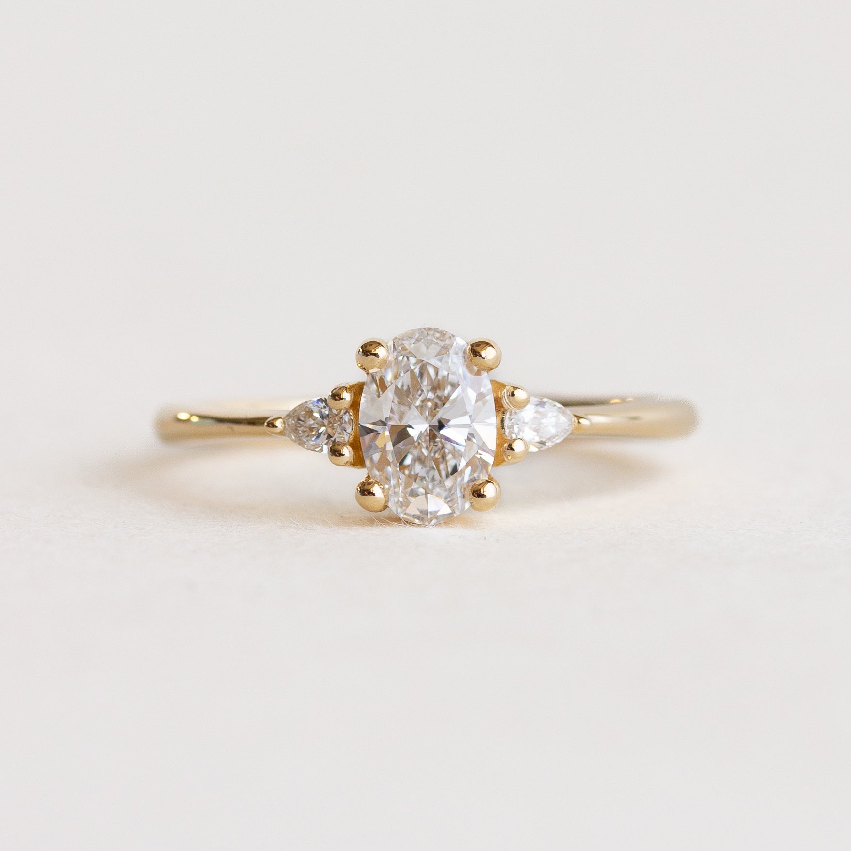 White Oval Stone Pear Sides Engagement Ring