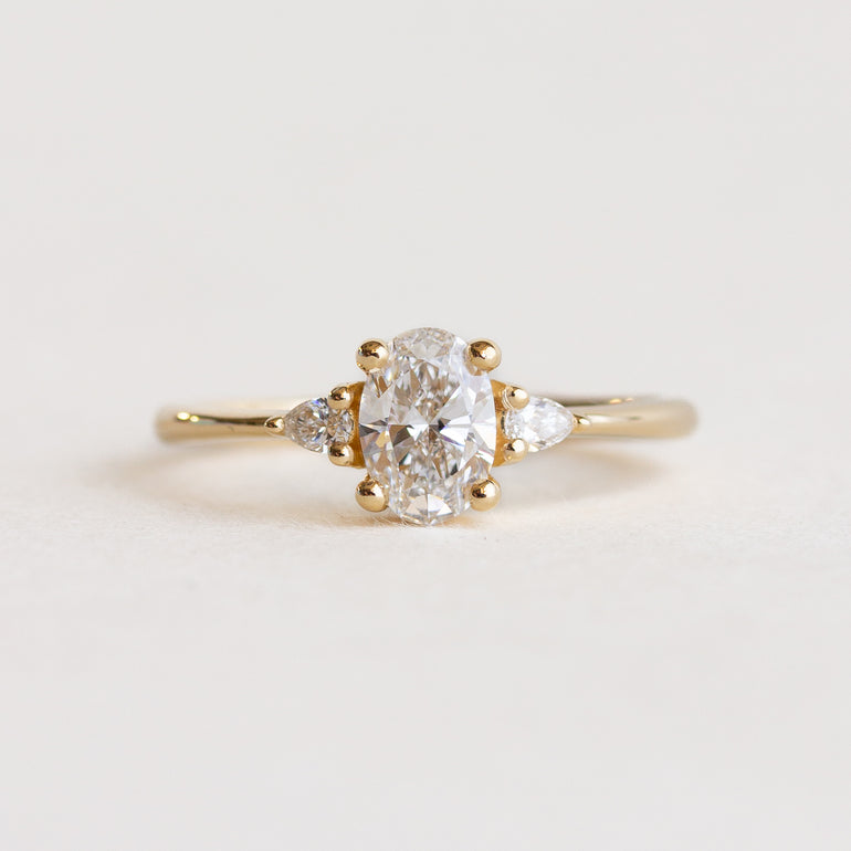 White Oval Stone Pear Sides Engagement Ring