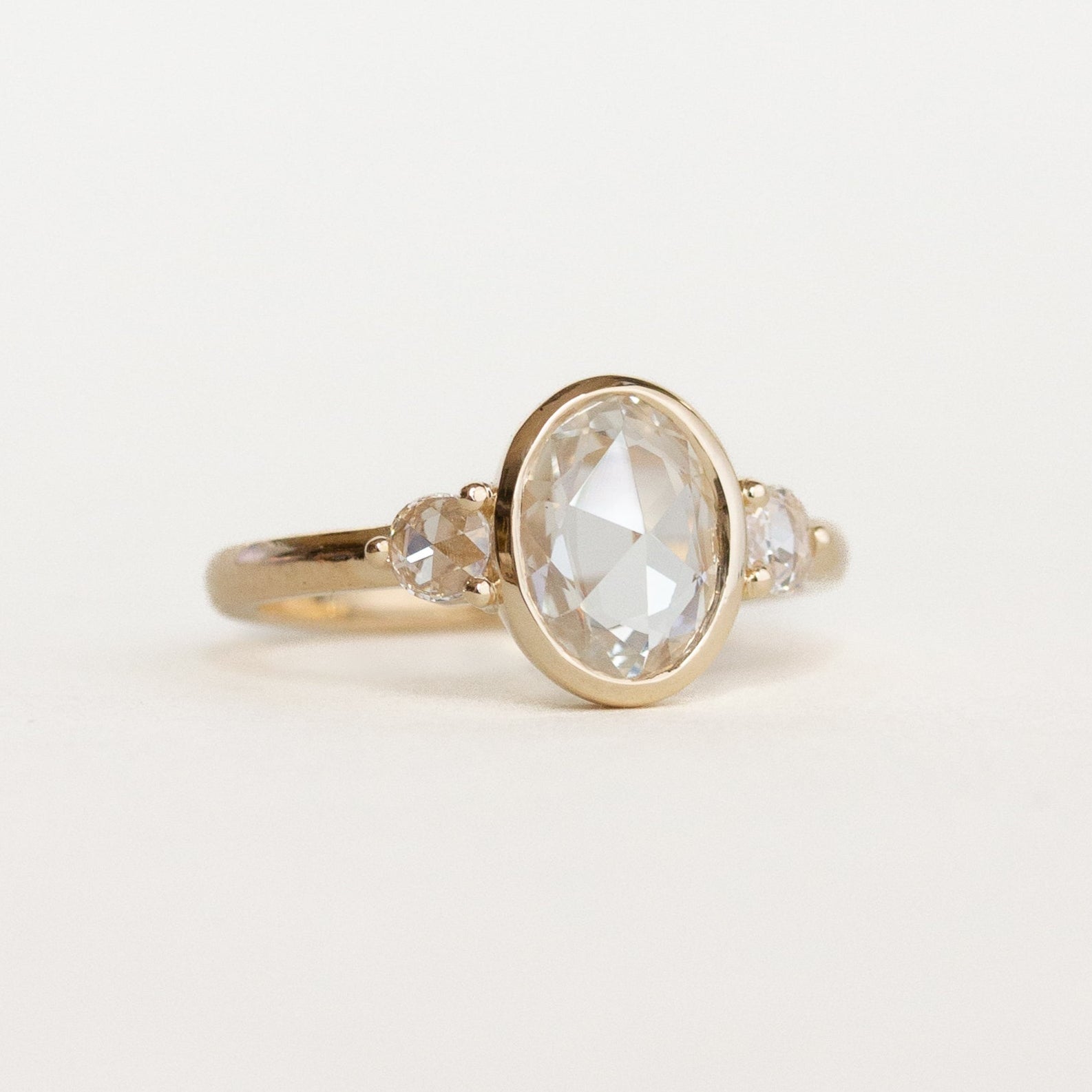 Oval Three Stone Bezel Engagement Ring