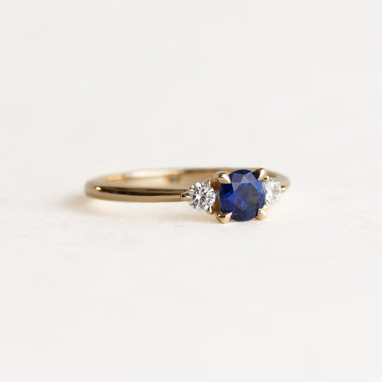 Round Sapphire Side Stone Engagement Ring