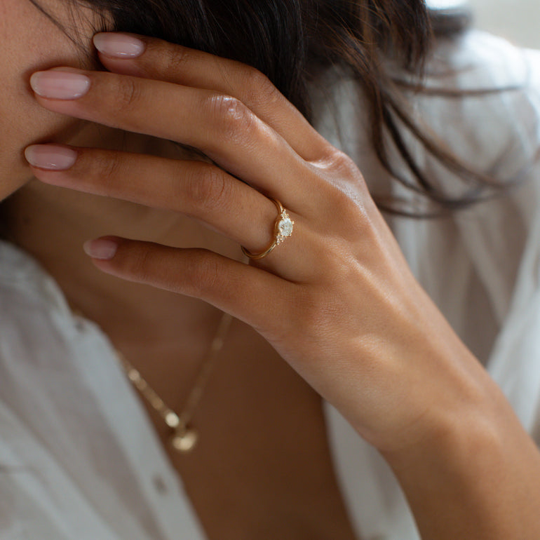 White Stone And Side Stone Engagement Ring