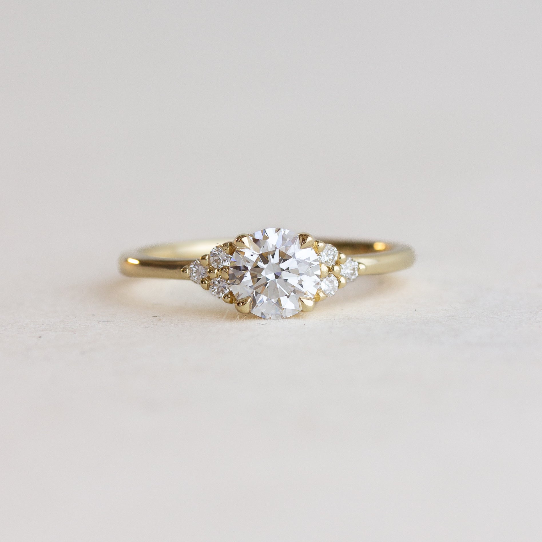 White Stone And Side Stone Engagement Ring