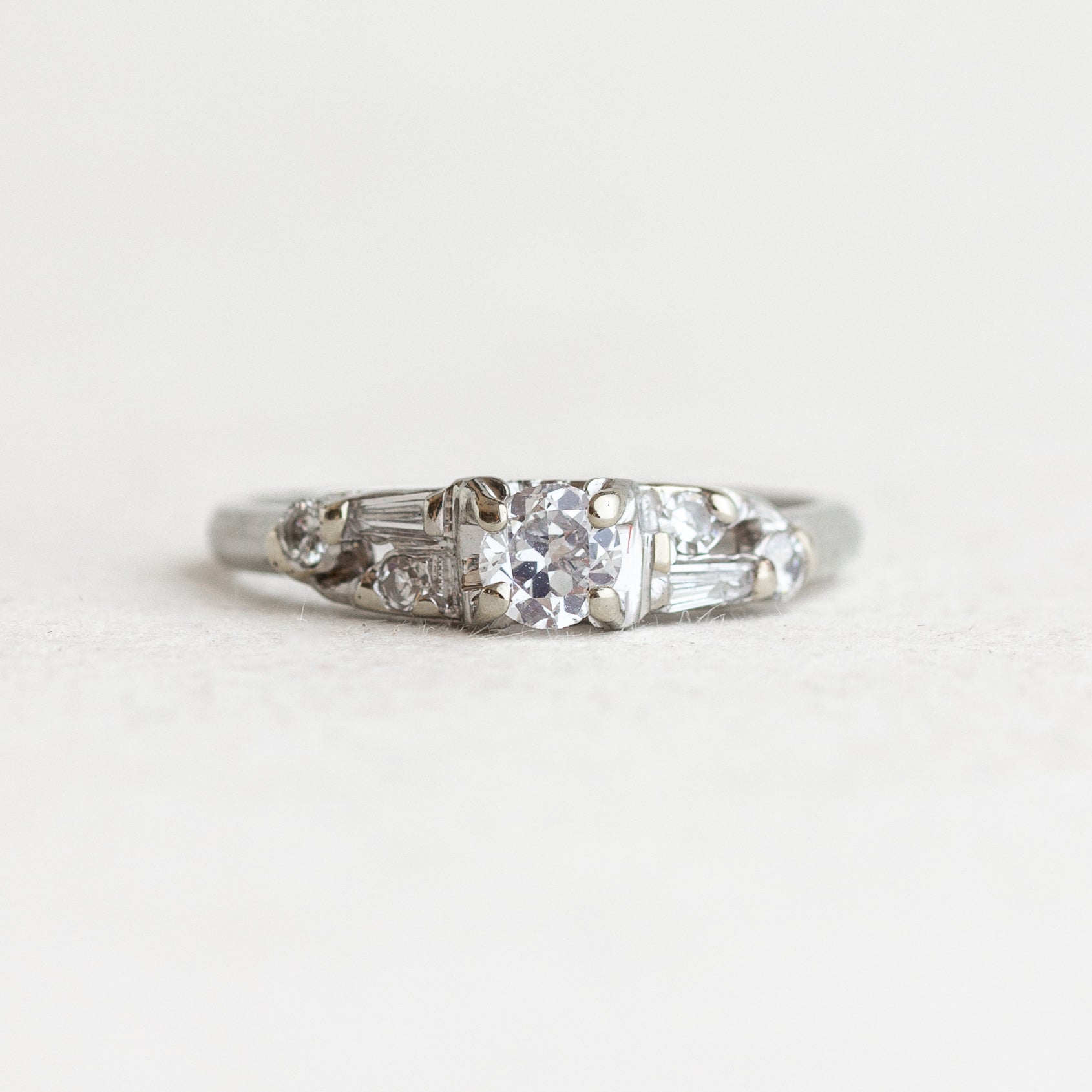 Round Diamond Vintage Engagement Ring With Tapered Baguettes