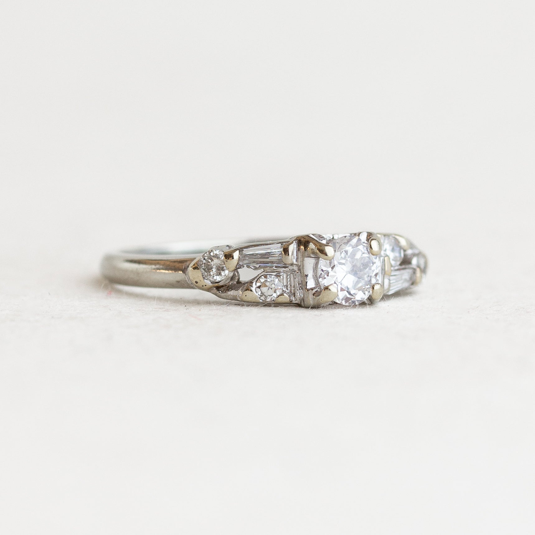 Round Diamond Vintage Engagement Ring With Tapered Baguettes