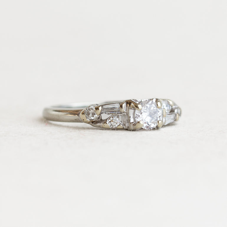 Round Diamond Vintage Engagement Ring With Tapered Baguettes