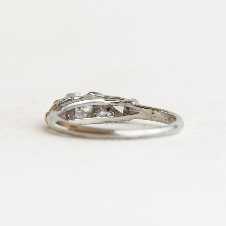 Round Vintage Engagement Ring With Tapered Baguettes
