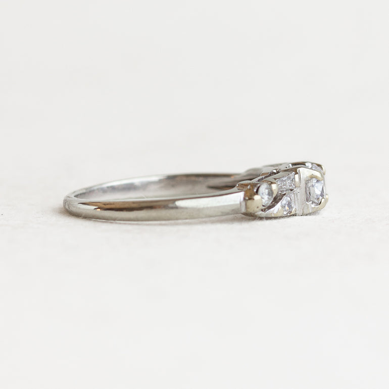 Round Diamond Vintage Engagement ring With Tapered Baguettes