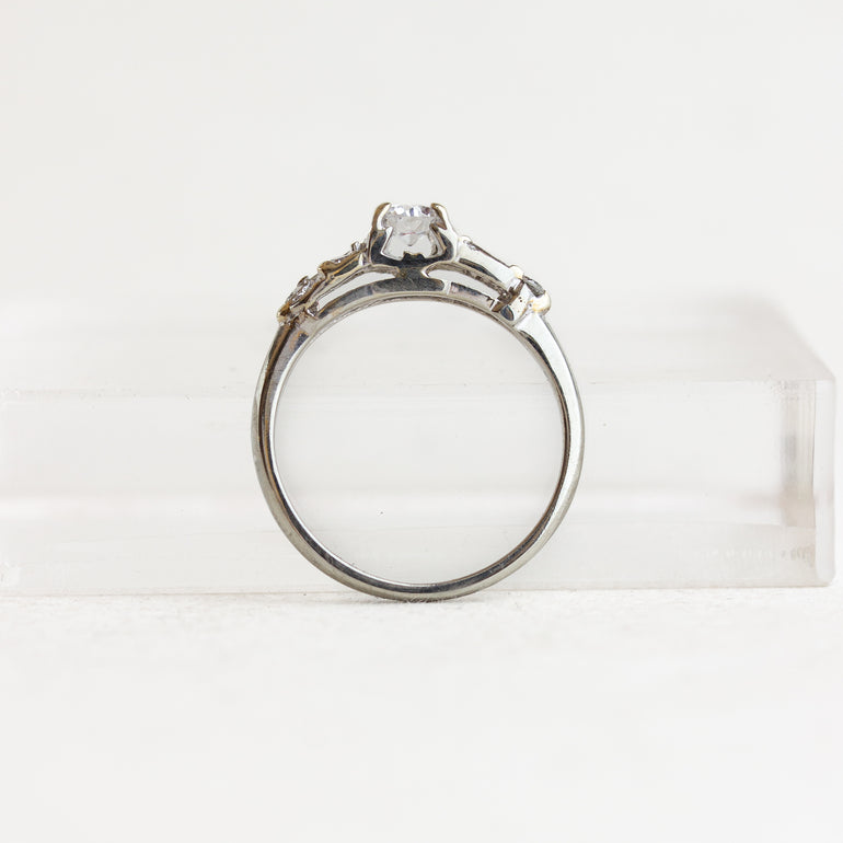 Round Vintage Engagement Ring With Tapered Baguettes