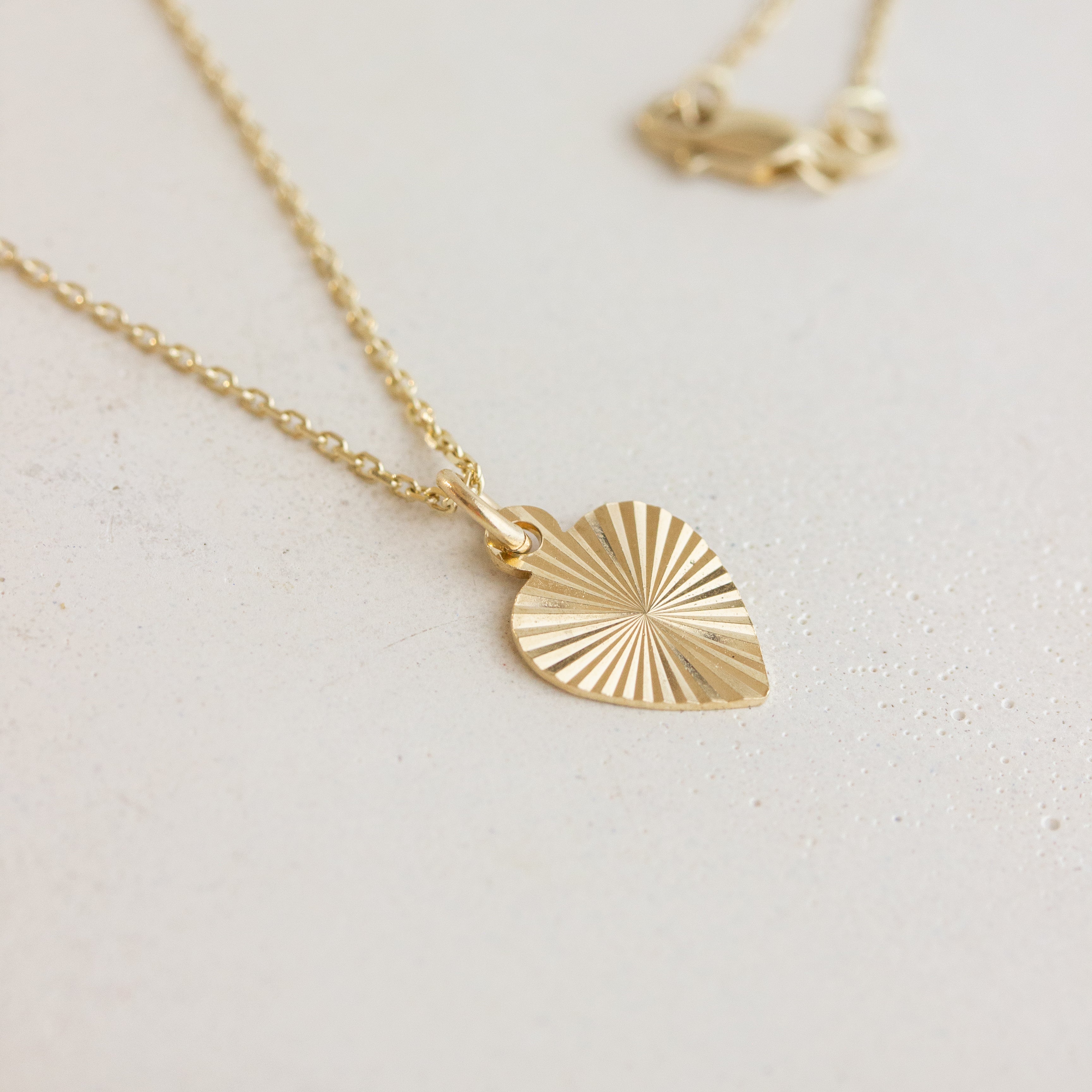 engraved heart charm on chain
