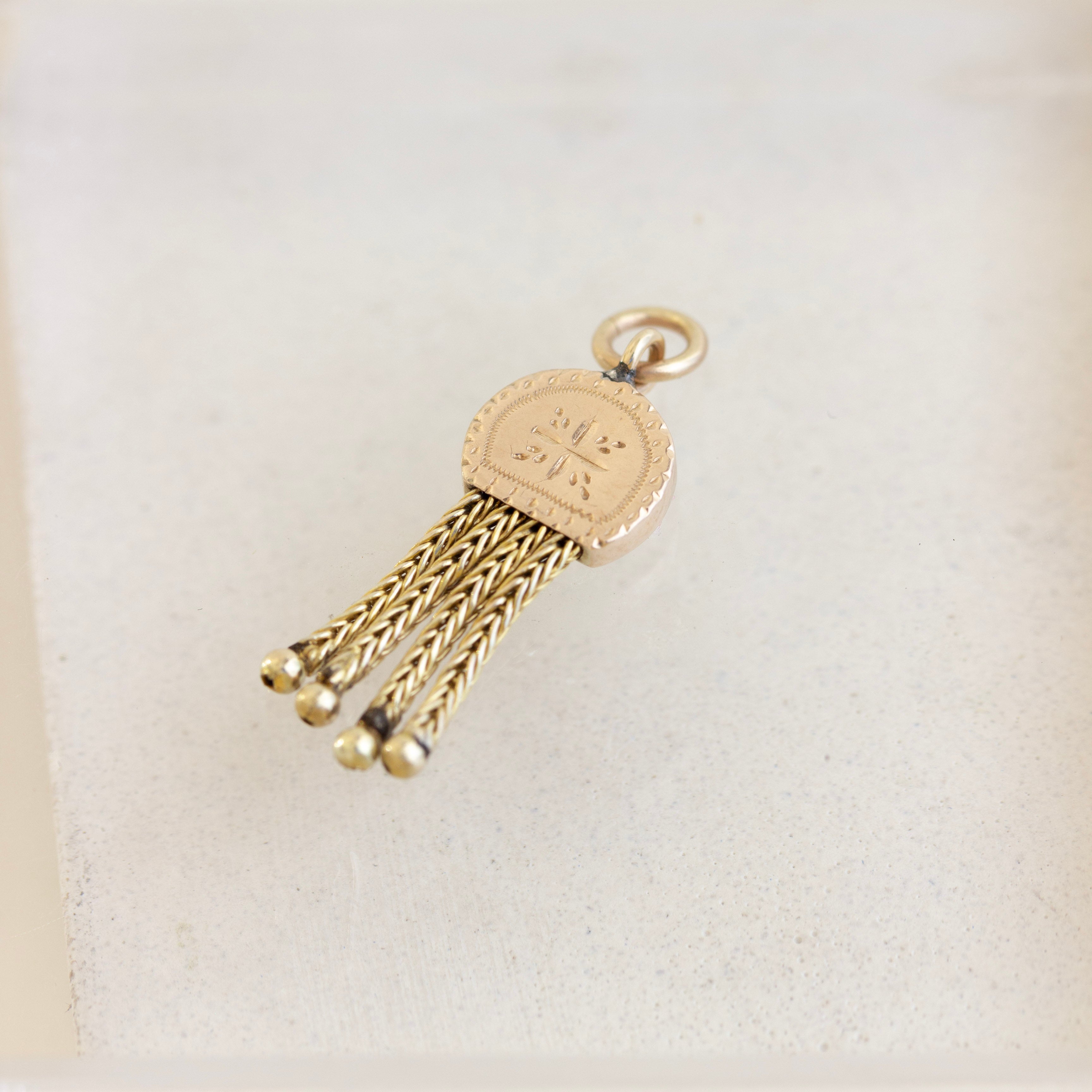 gold tassel charm