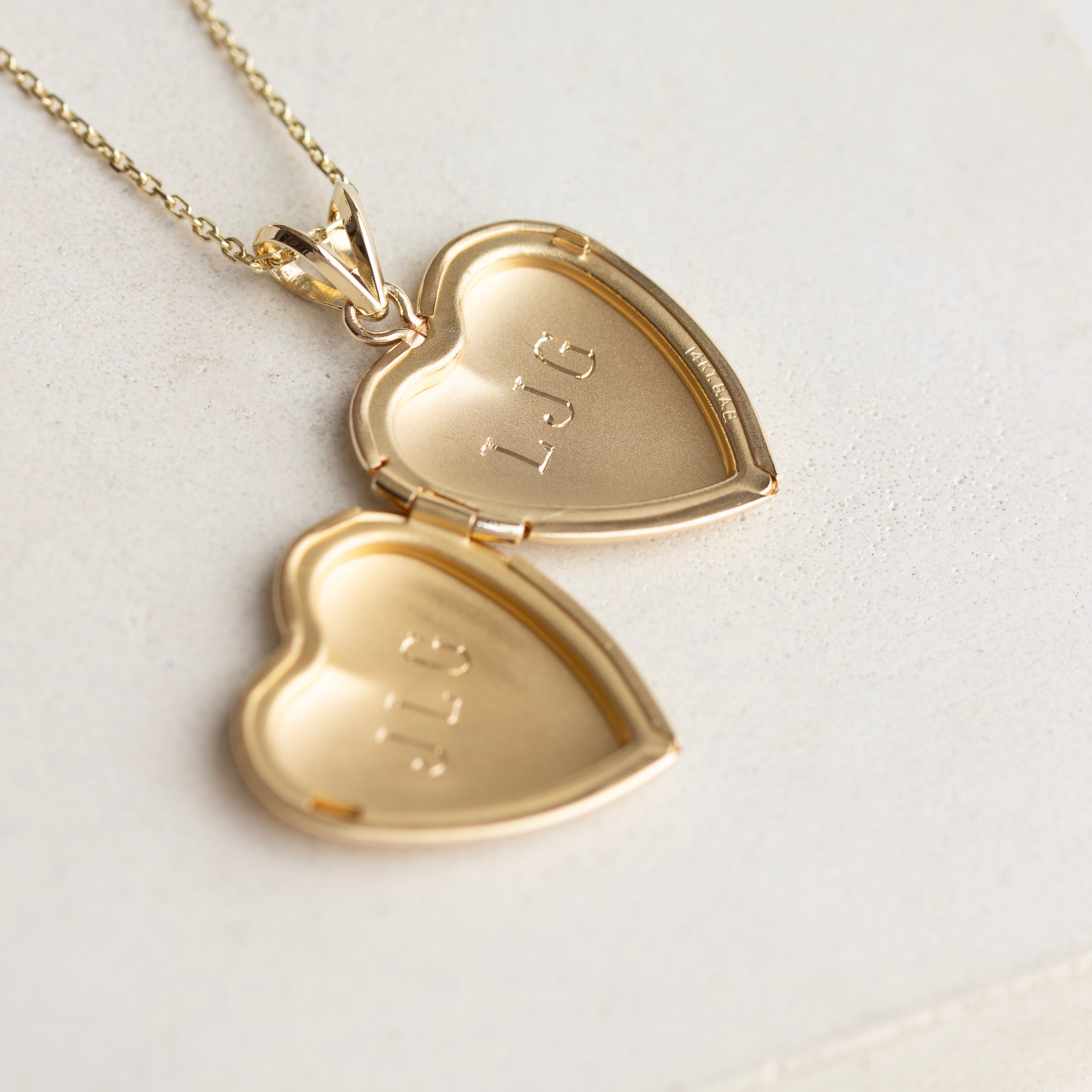 vintage heart locket engraved inside with JLG and LJG