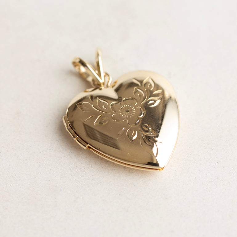 vintage heart locket with floral engraving