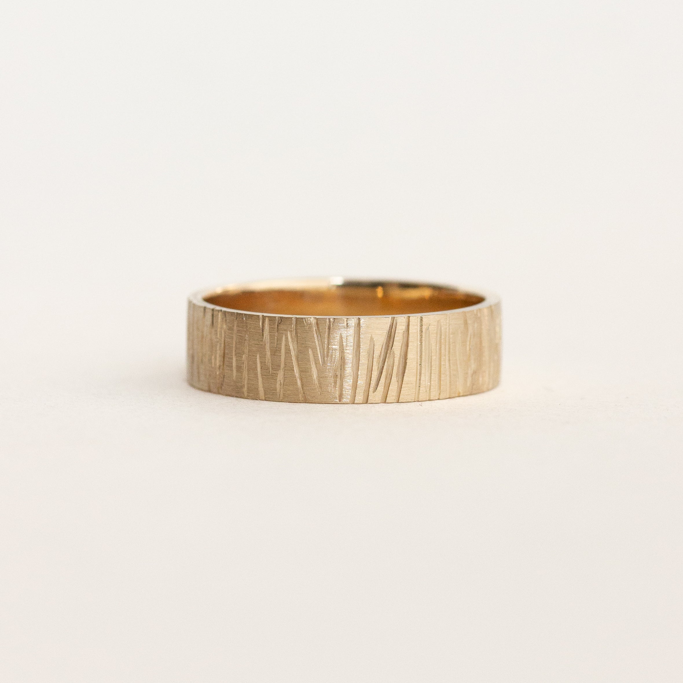 wedding band with cedar texture details