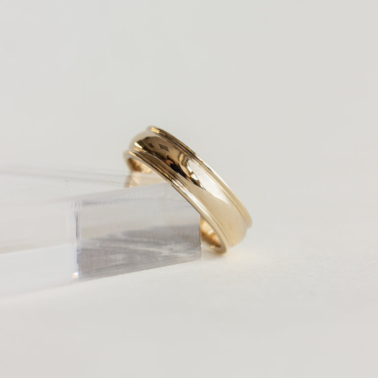 wide cigar wedding band with detailing