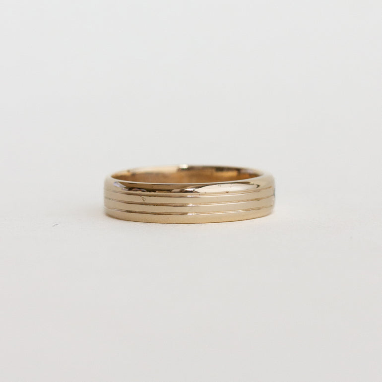 etching detail flush set stone wedding band