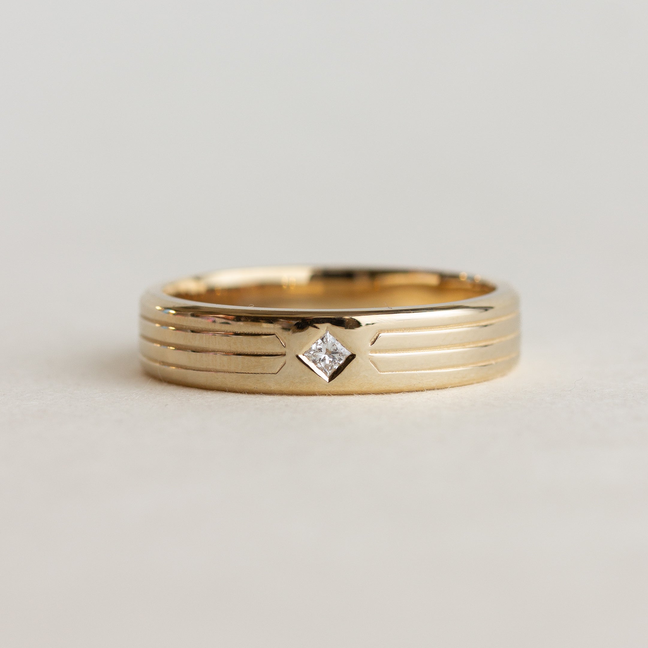 etching detail flush set stone wedding band