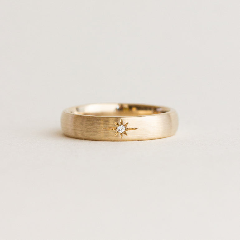 satin star engraved gold wedding band with diamond