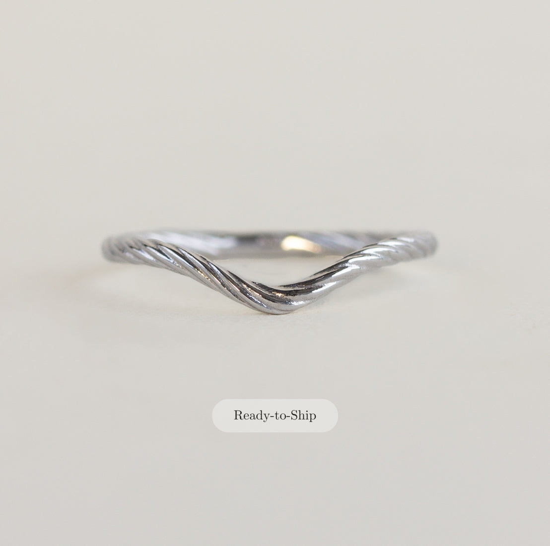 18K white gold rope contour wedding band on a white background