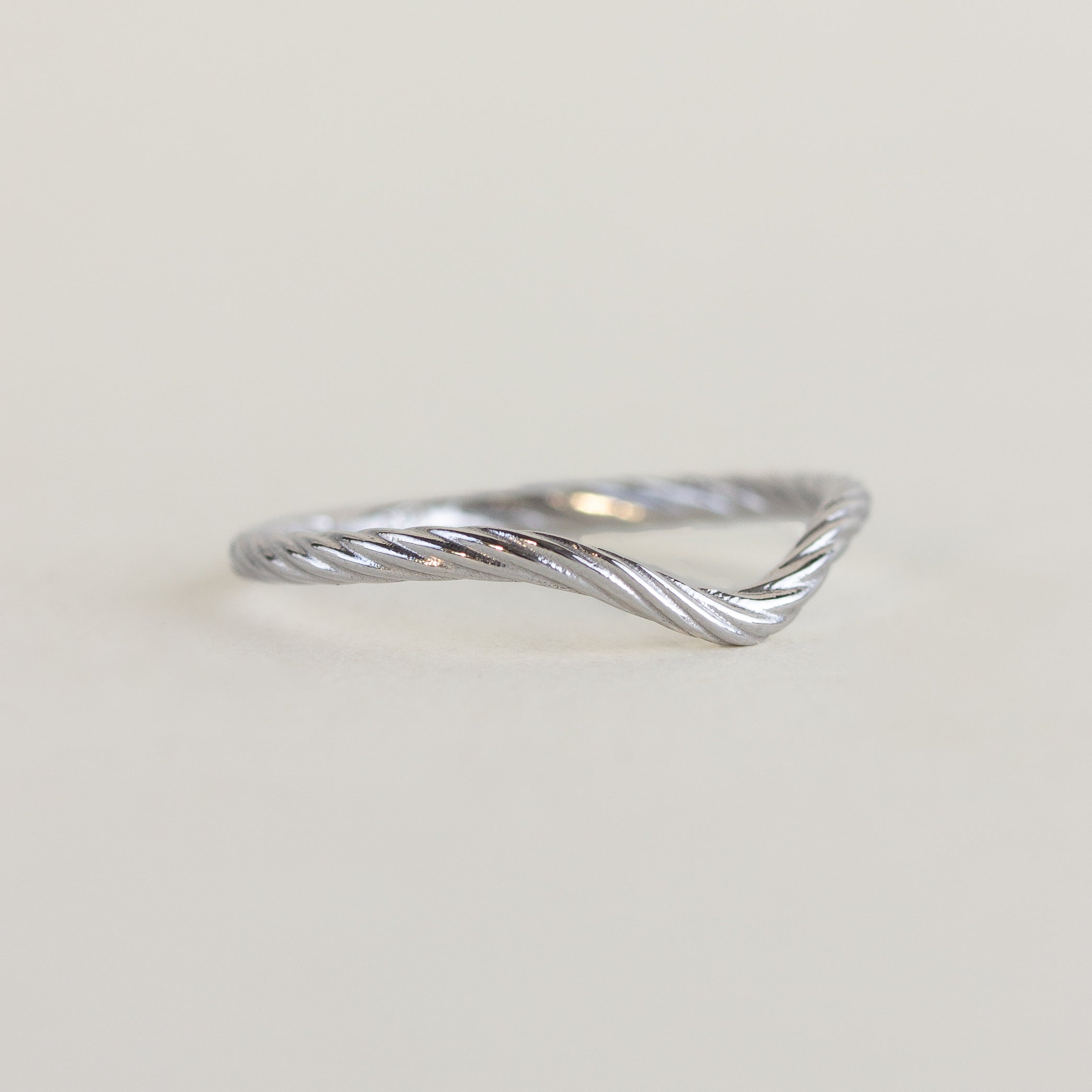 18K white gold rope contour wedding band on a white background