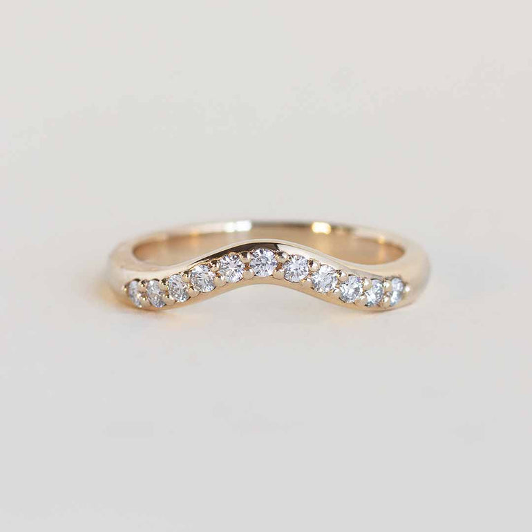Yellow gold contour band with 11 channel set diamonds