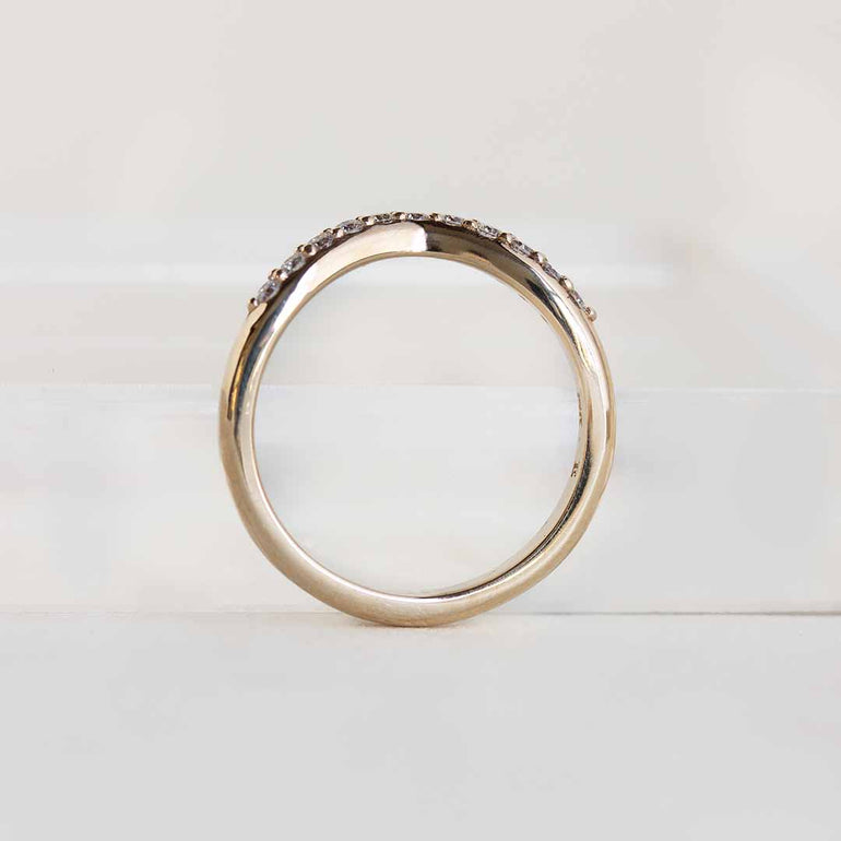Yellow gold contour band with 11 channel set diamonds
