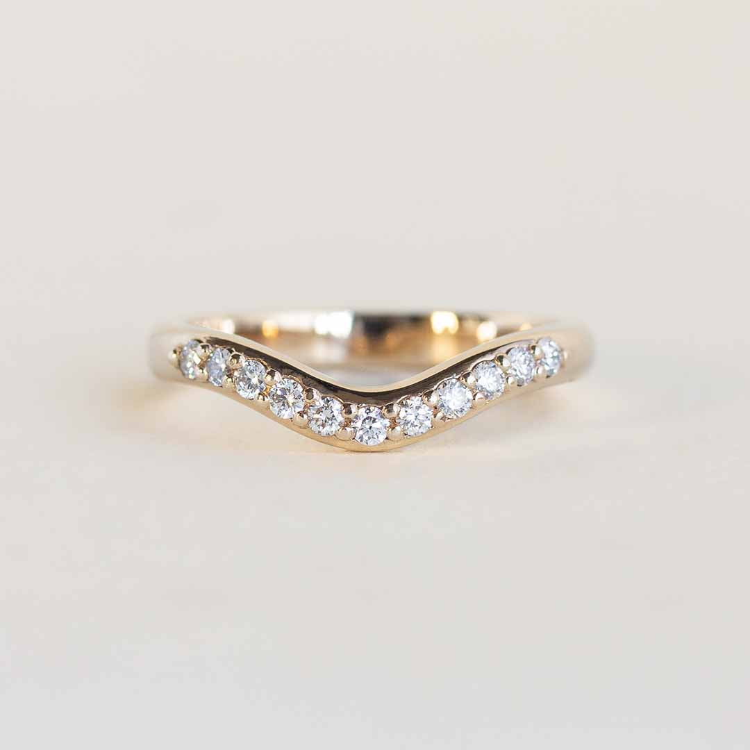 Yellow gold contour band with 11 channel set diamonds