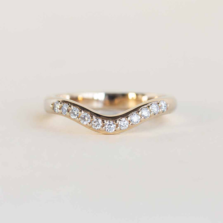 Yellow gold contour band with 11 channel set diamonds