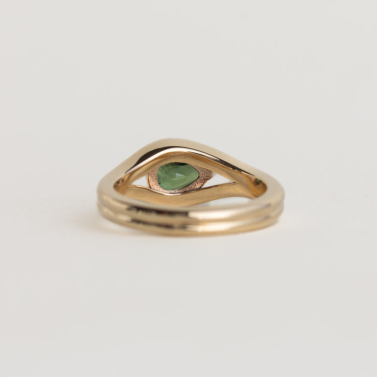 14K gold Lola ring with an east-west pear shaped, medium-green sapphire