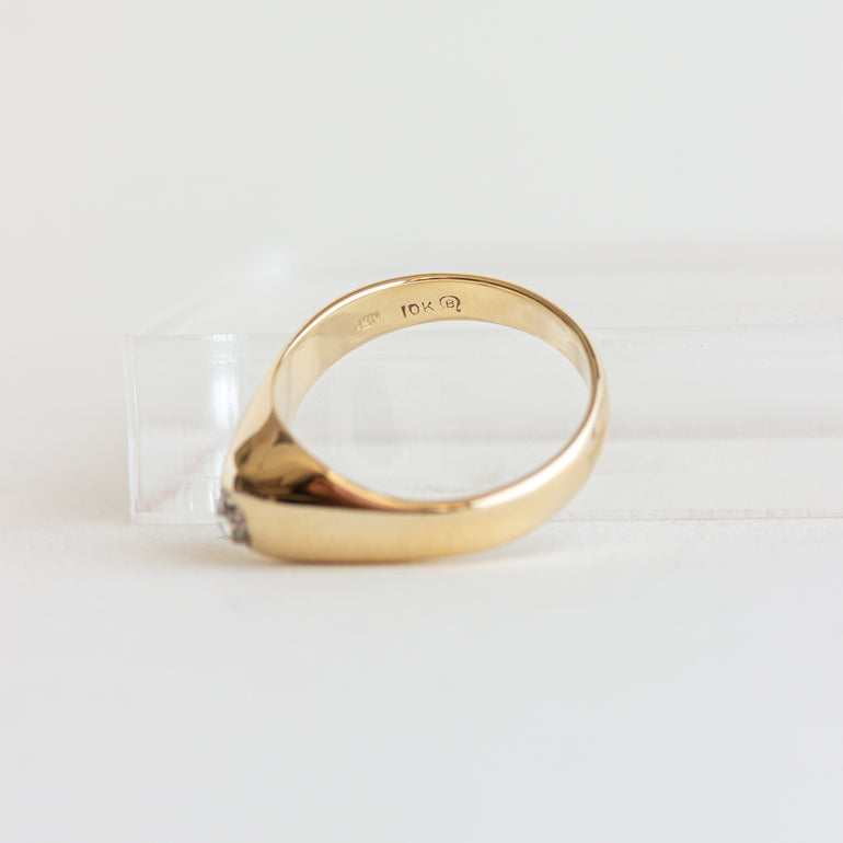 Gold ring on a white background