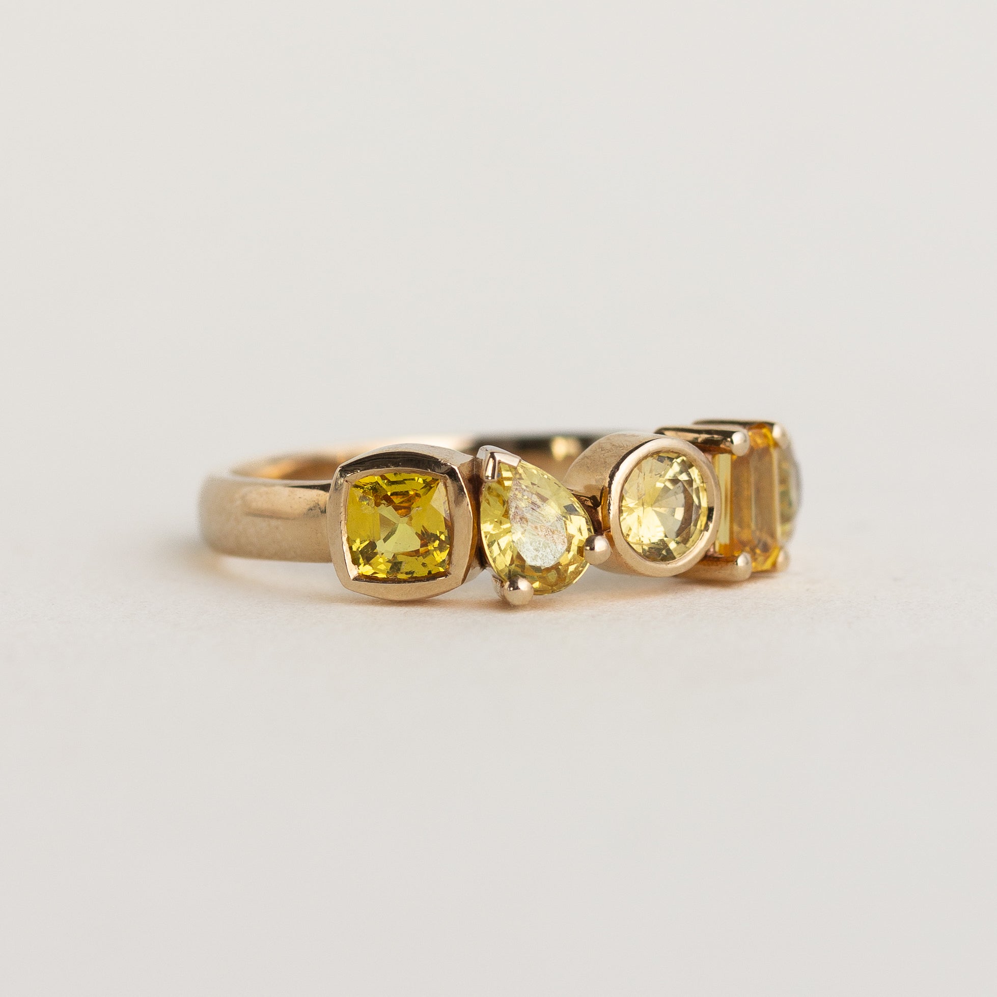 14k gold five-stone cluster engagement ring with yellow sapphires