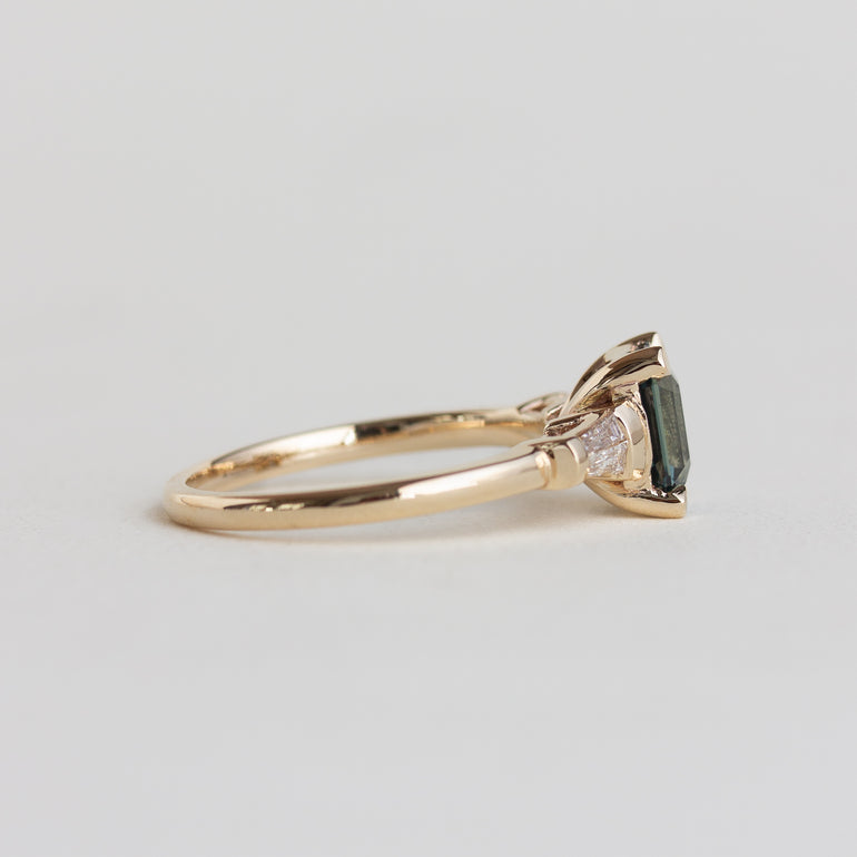 14k gold Art Deco style ring with teal sapphire and baguette diamonds