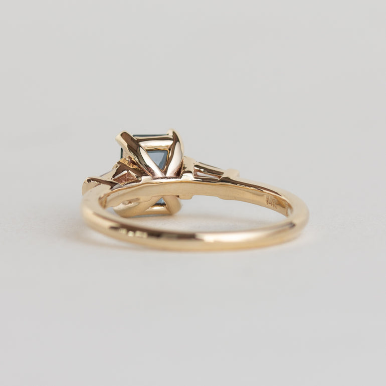 14k gold Art Deco style ring with teal sapphire and baguette diamonds