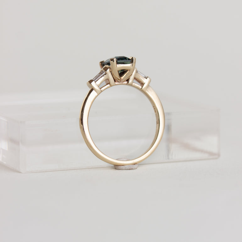 14k gold Art Deco style ring with teal sapphire and baguette diamonds