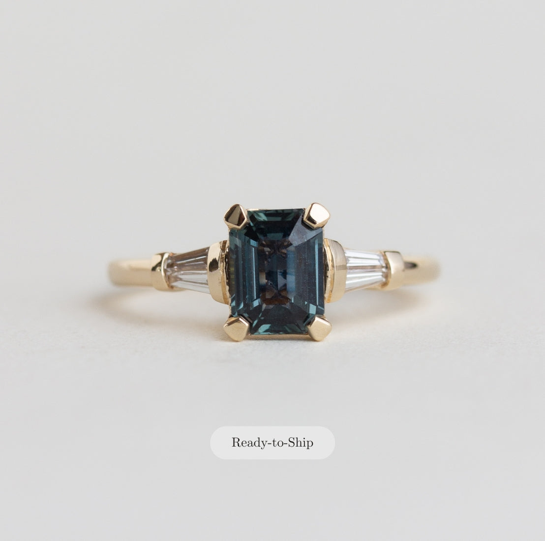 14k gold Art Deco style ring with teal sapphire and baguette diamonds