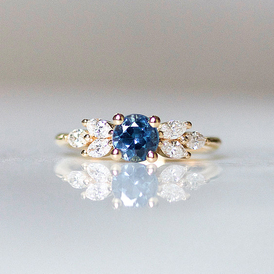 EVA Ring- Teal Sapphire Engagement Ring- Three marquise cut diamonds on either side set atop 14k yellow gold.