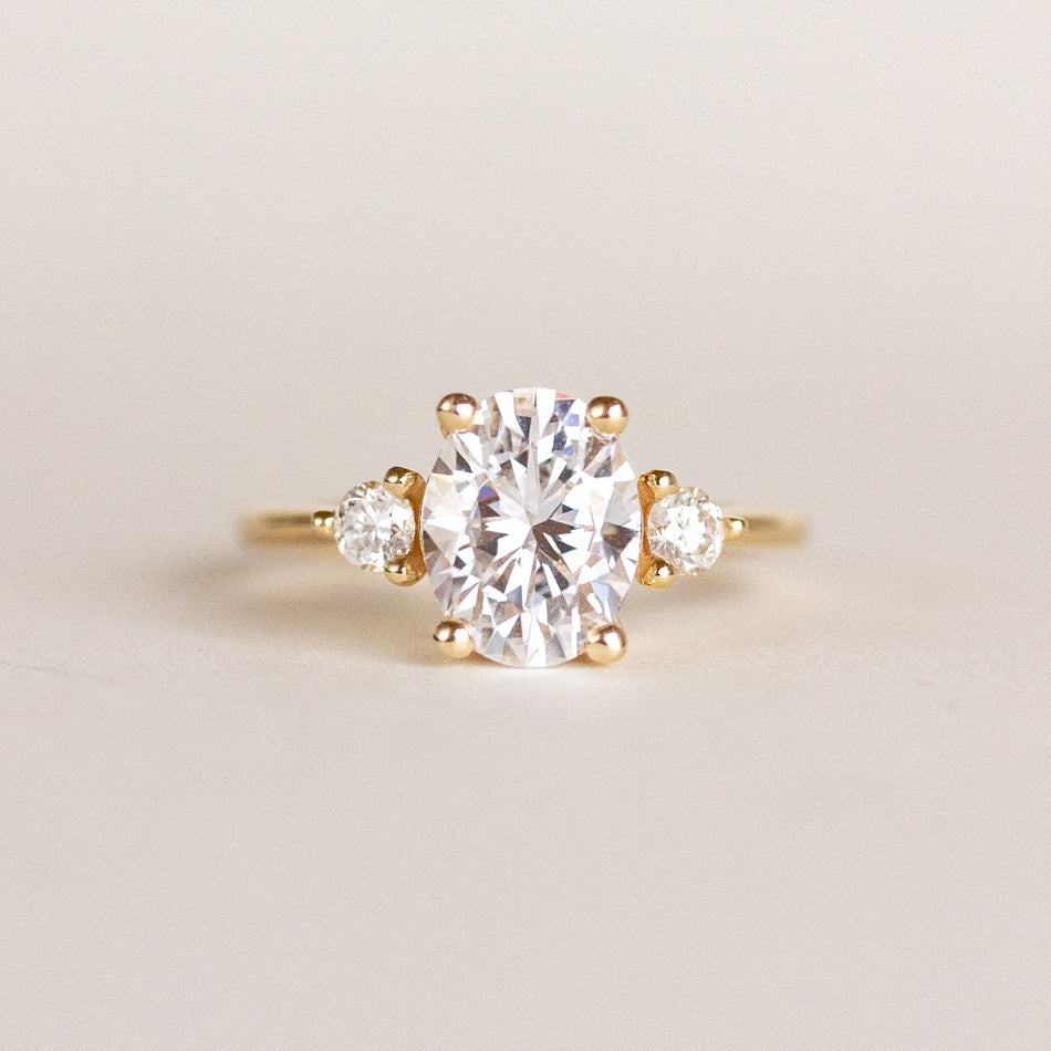 Three White stone Oval Engagement Ring 