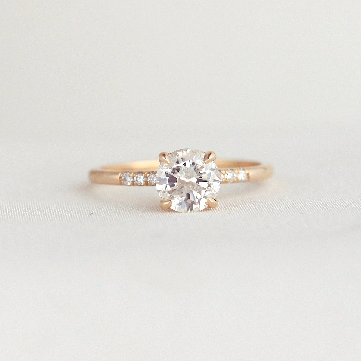 Round Diamond Side Stone Engagement Ring