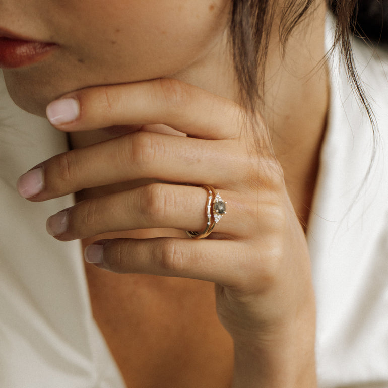 contour diamond wedding band with engagement ring on models hand