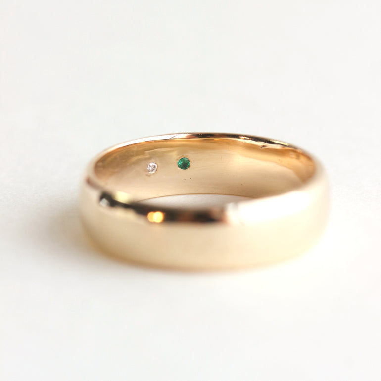 hidden birthstones on half round wedding band